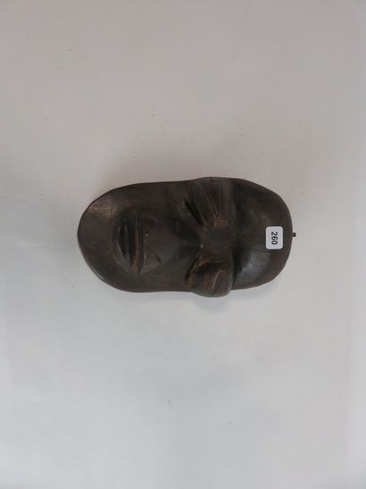 Face mask. Wood with brown patina. Height...