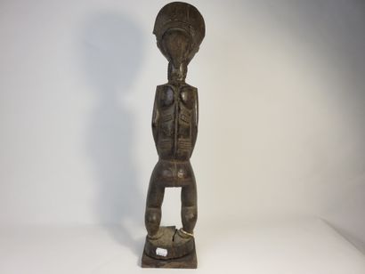 Male ancestor standing with both hands on...