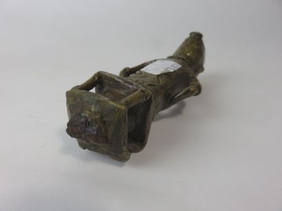 Cane top representing a female figure seated...