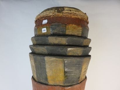 Curved cylinder drum on legs. Polychrome...