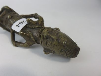 Cane top representing a female figure seated...