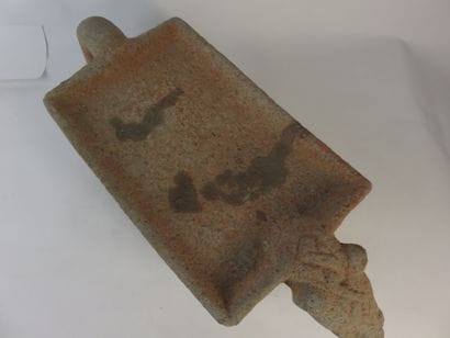 Metate. Grinding table representing a jaguar....