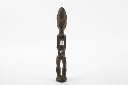 Male ancestor standing with both hands on...
