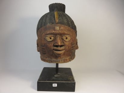 Ancient Gelede helmet mask. The face is decorated...