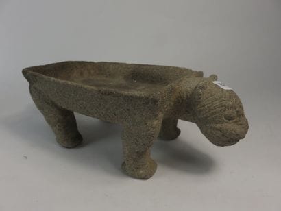 Metate. Grinding table representing a jaguar....