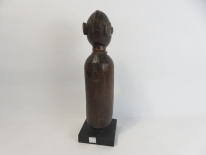 Small slotted drum used by diviners. It is...