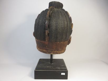 Ancient Gelede helmet mask. The face is decorated...