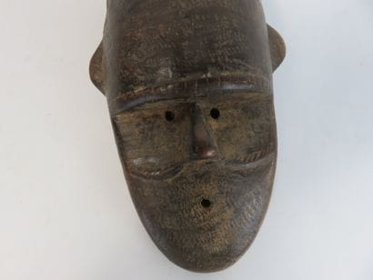 Passport mask representing a face with two...