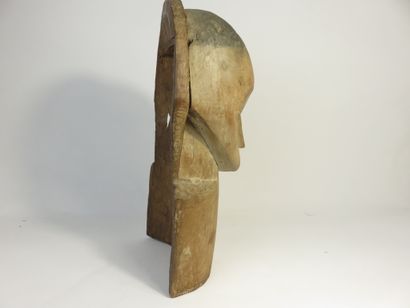 Bust mask. The face is heart-shaped. Hardwood...