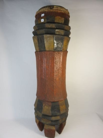 Curved cylinder drum on legs. Polychrome...