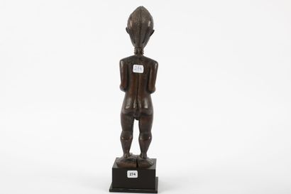 Male ancestor standing with both hands on...