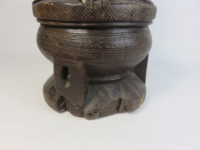 Mortar and pestle. Wood with a patina of...