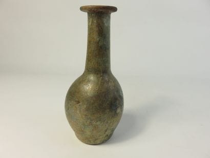 Bottle. Iridescent glass. Height : 19,5 cm....