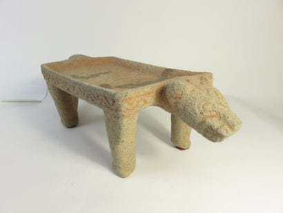 Metate. Grinding table representing a jaguar....
