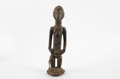 Female ancestor standing with both hands...