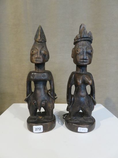 Couple shown standing with both hands on...