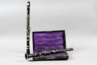 A pair of Boehm system ebony clarinets stamped...