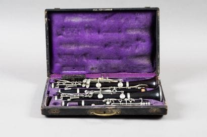 A pair of Boehm system ebony clarinets stamped...