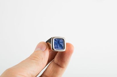 Gold signet ring holding a lapis lazuli intaglio...