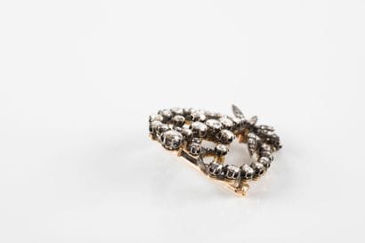 Gold and silver brooch decorated with scrolls,...
