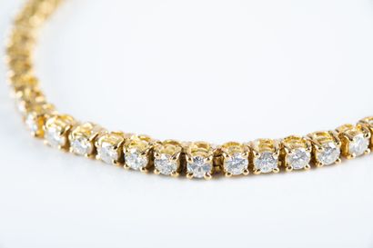Gold river bracelet, set with brilliant cut...