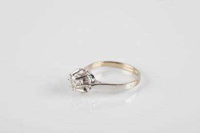 Gold and platinum solitaire ring set with...