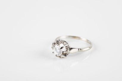 Gold and platinum solitaire ring set with...