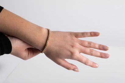 Gold river bracelet, set with brilliant cut...