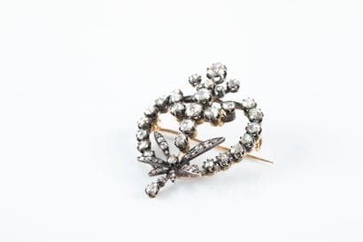 Gold and silver brooch decorated with scrolls,...