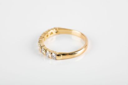 Gold half wedding band set with nine brilliant-cut...