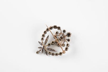 Gold and silver brooch decorated with scrolls,...