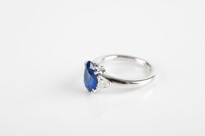White gold ring set with a certified oval...