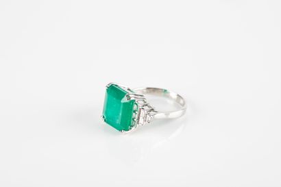 White gold ring set with a large emerald...