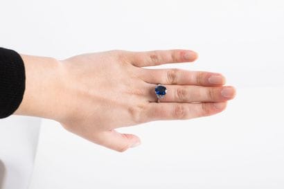 White gold ring set with a certified oval...