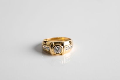 Gold ring set with a brilliant-cut diamond...