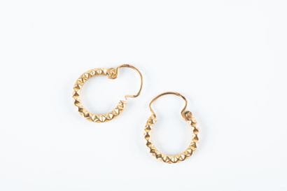 Pair of creole earrings in yellow gold with...