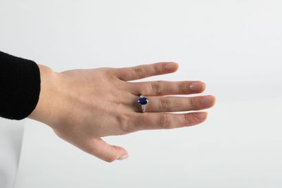 White gold ring set with a certified oval...