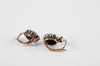 Pair of gold and silver earrings set with...