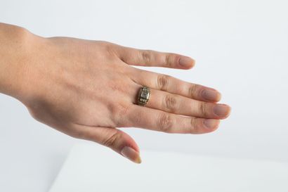 Gold ring decorated with geometric patterns...