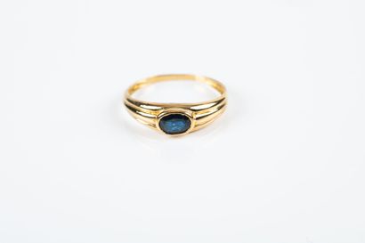 Yellow gold ring set with a sapphire (slightly...