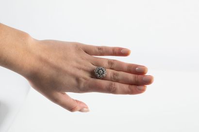 Gold and platinum daisy ring set with a diamond...