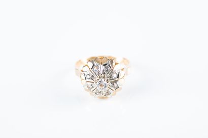 Gold ring featuring a half-sphere decorated...