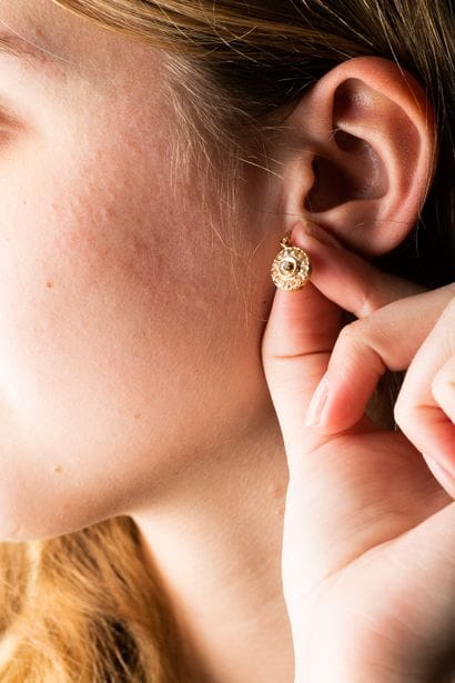 Pair of yellow gold circular sleeper earrings,...
