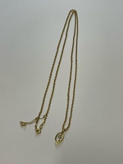 Gold long necklace, with a pendant centered...