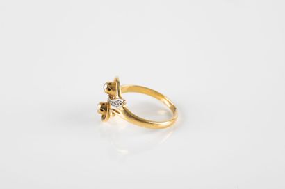 Yellow gold ring, representing two moving...