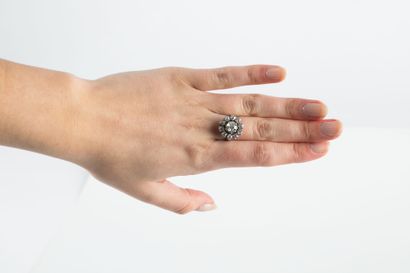 Gold and platinum ring holding one old-cut...