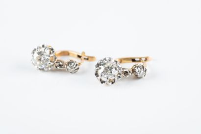 Pair of gold and platinum sleeper earrings...