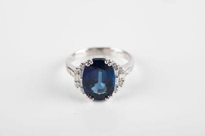 White gold ring set with a certified oval...