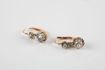 Pair of yellow gold earrings adorned with...