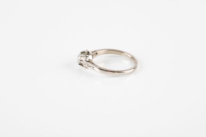 Gold and platinum solitaire ring set with...